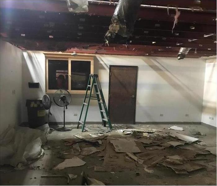 collapsed ceiling, water damage on roof caused ceiling to collapsed